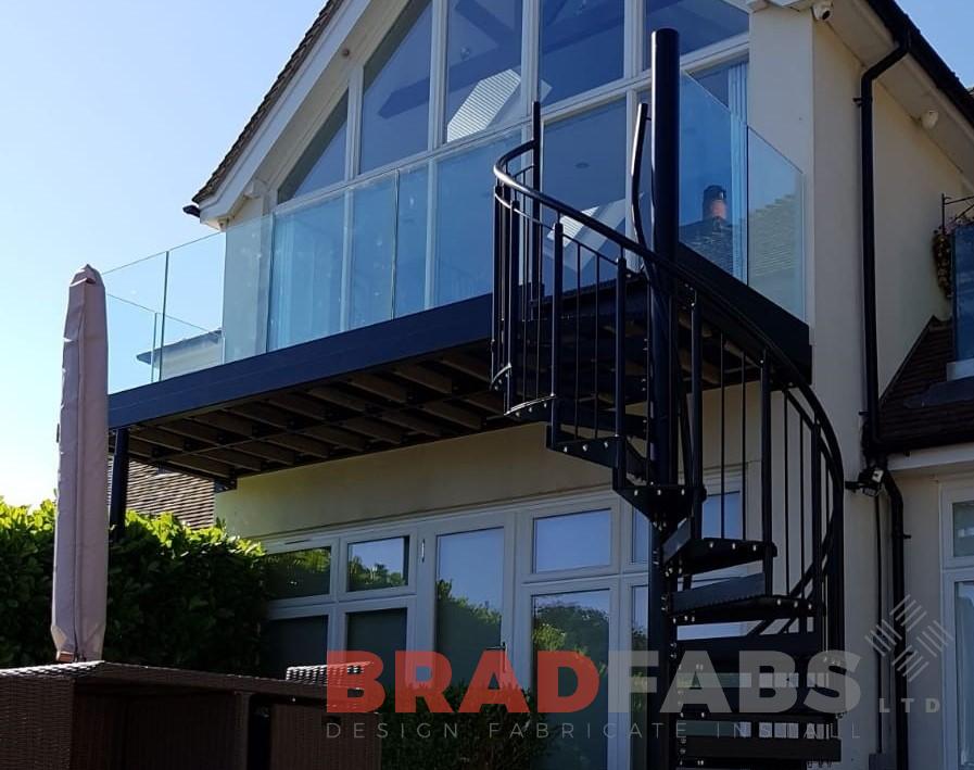 Infinity glass balcony with metal spiral by Bradfabs