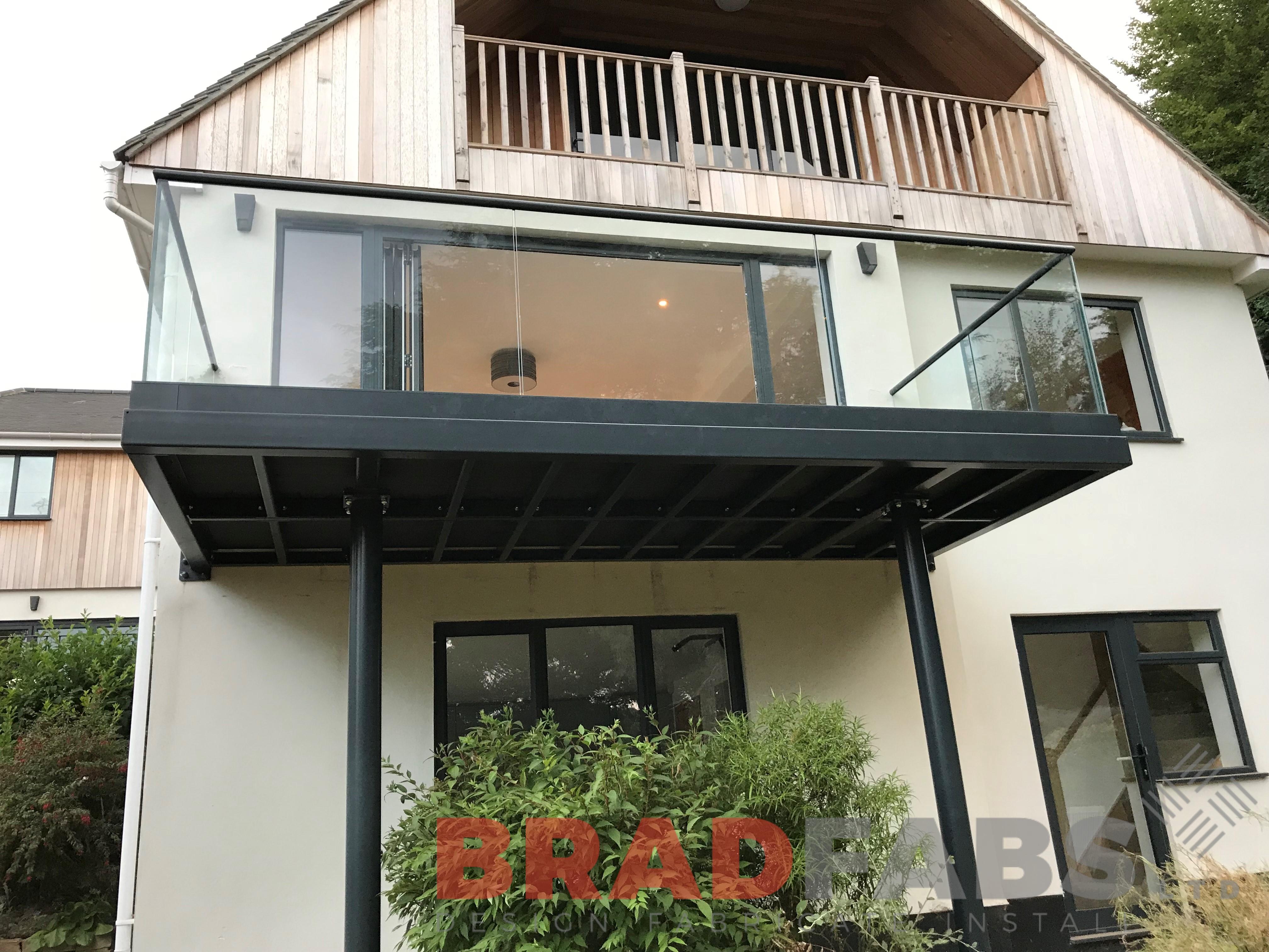 Bespoke designed metal and infinity glass balcony by Bradfabs