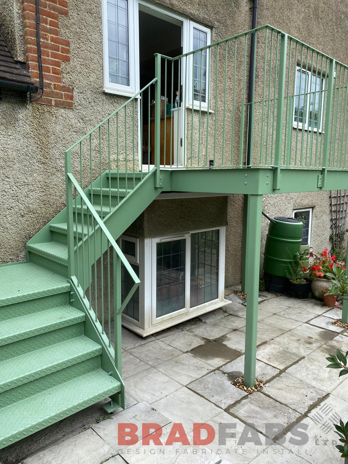 bespoke balcony and straight staircase by Bradfabs, mild steel, galvanised and powder coated with durbar treads and landings 