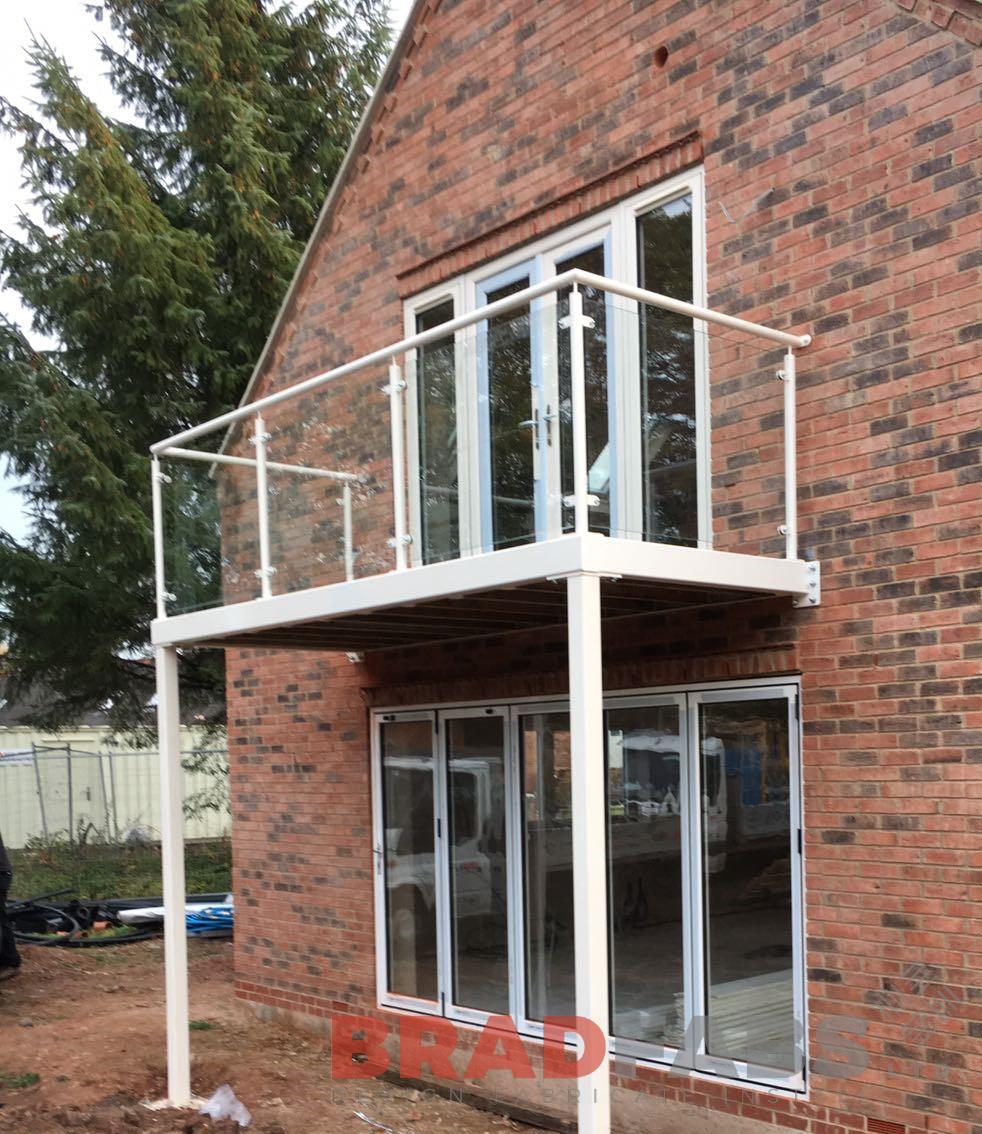 Bradfabs, Mild steel balcony, balcony with legs, powder coated, galvanised balcony, glass infill panels 
