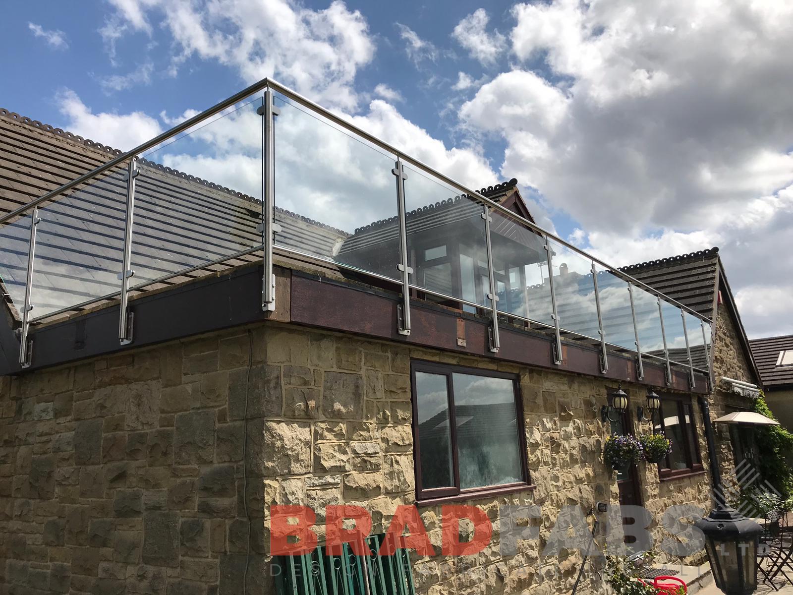 Bespoke balustrade added to customers existing roof, safety glass with stainless steel top rail by bradfabs 