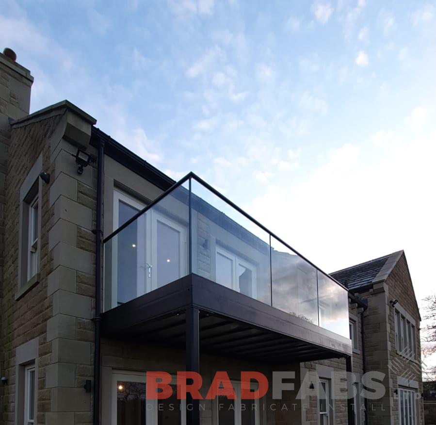 mild steel powder coated and galvanised toprail with glass balustrade by bradfabs ltd 