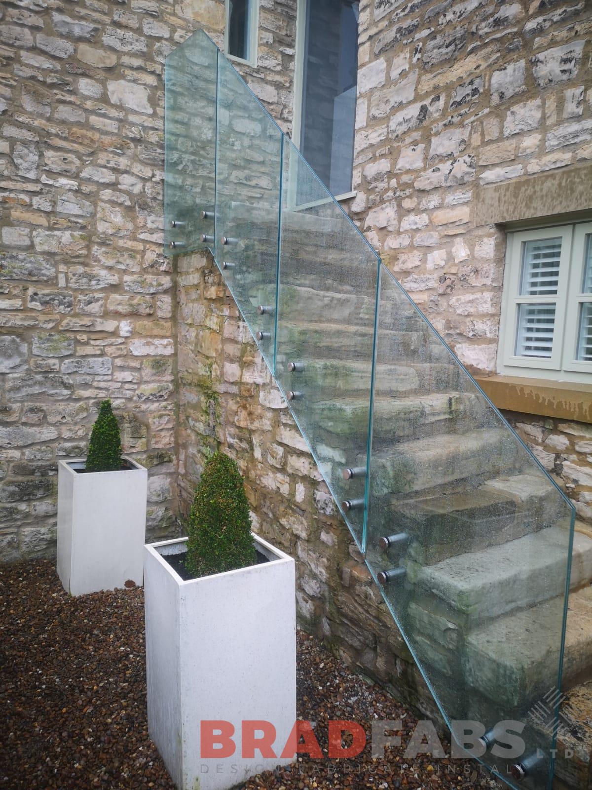 laminated safety glass balustrade for external stone steps by Bradfabs 