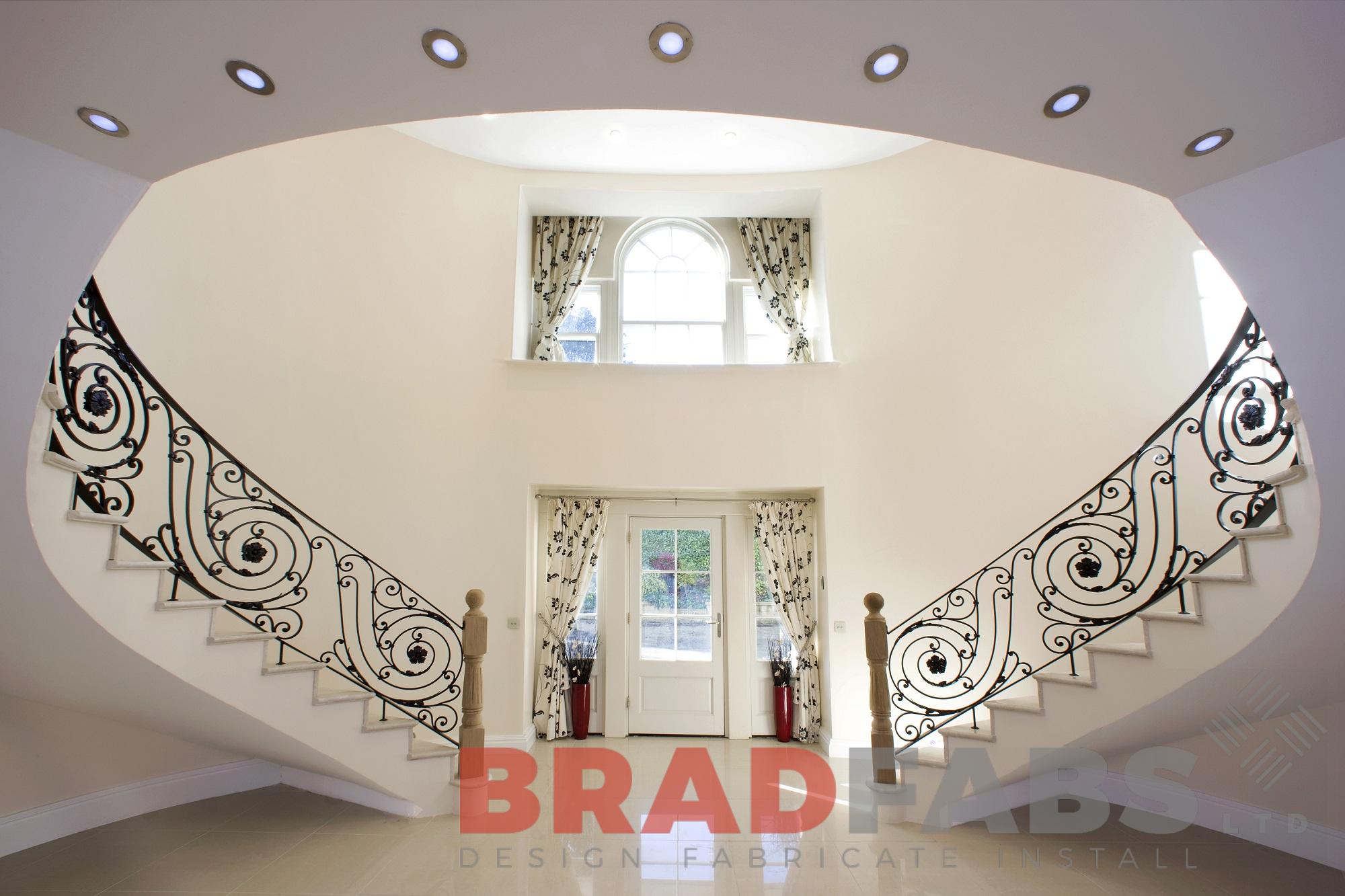 Curved high quality helix staircase with ornate balustrade