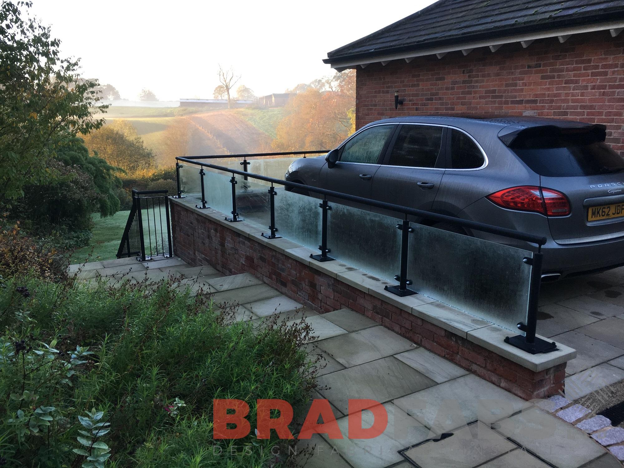 mild steel, galvanised, powder coated glass infill panels and vertical bar balustrade outdoor home improvements by Bradfabs 