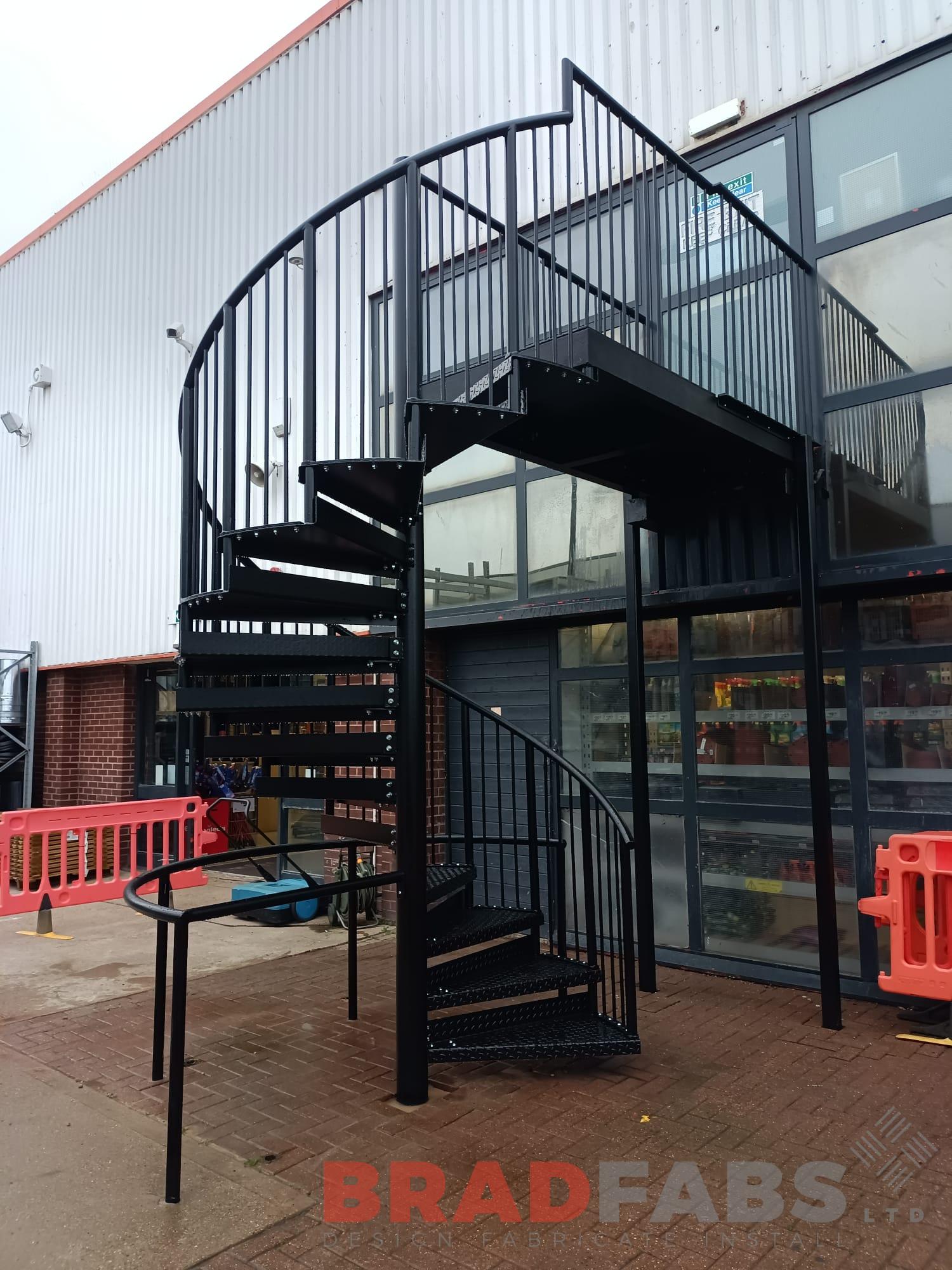 Spiral staircase, galvanised and powder coated black with durbar treads by Bradfabs 