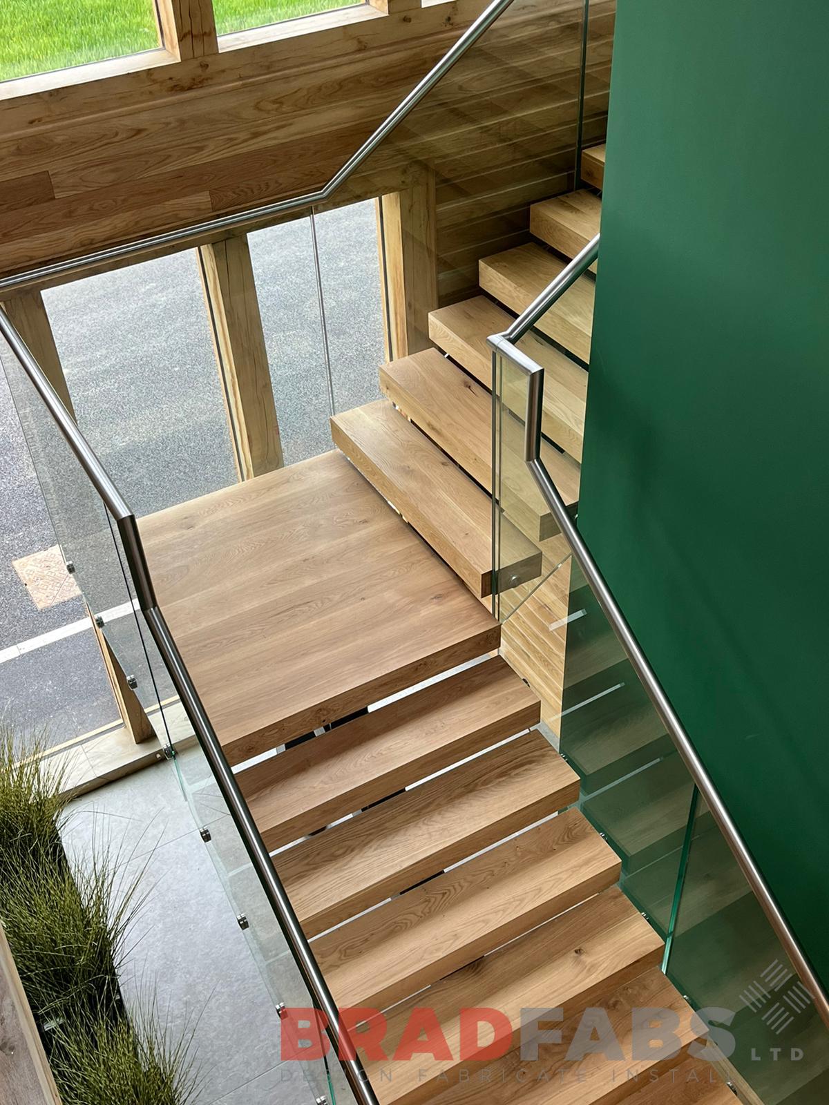 Bradfabs, stainless steel top rail, infinity glass, internal staircase, oak treads 