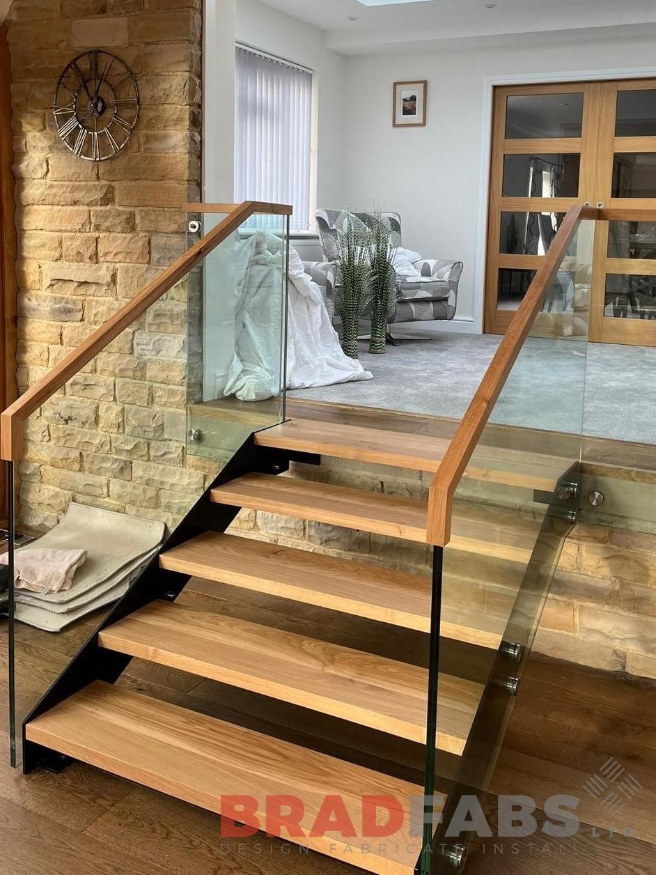 Staircase with glass and oak capping rail by bradfabs 