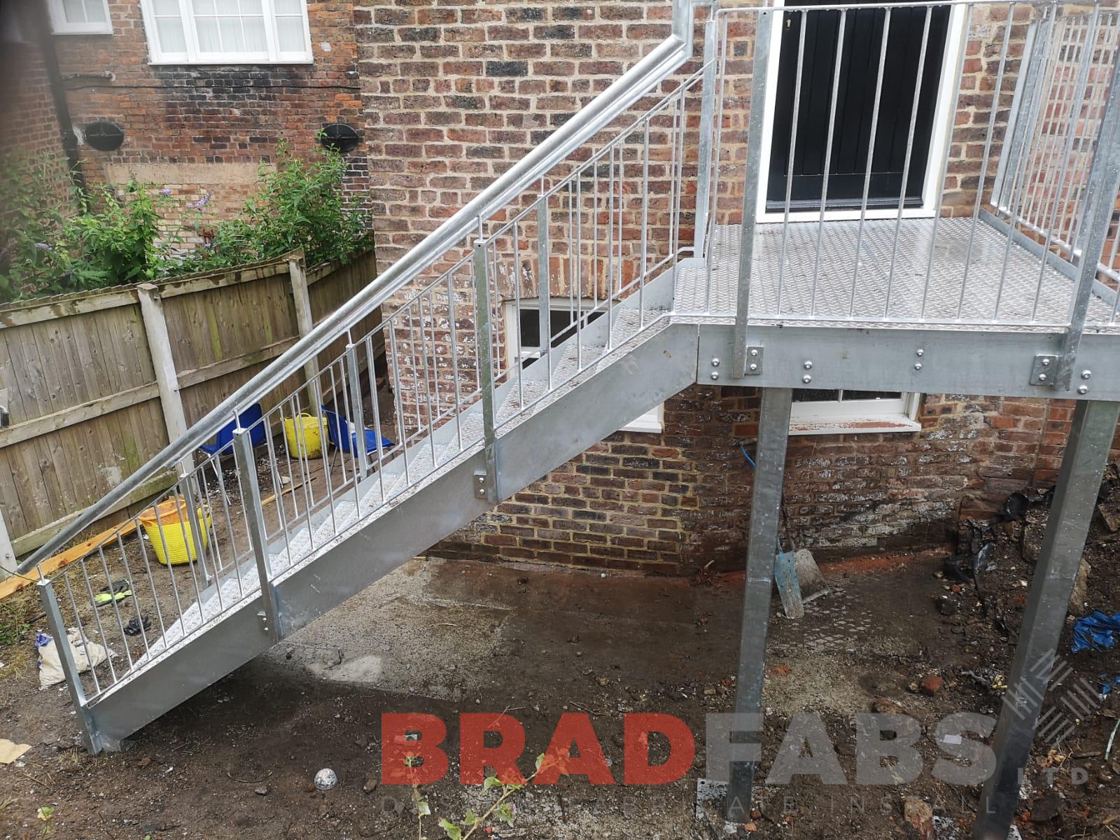 Straight external staircase with vertical bar balustrade and durbar treads by Bradfabs 