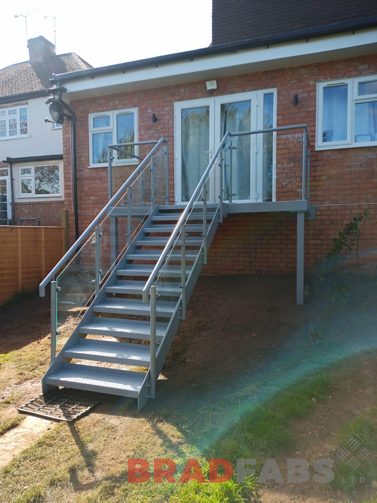 Bradfabs, staircase, external staircase, bespoke staircase, balcony and staircase, durbar treads, mild steel, galvanised steel, glass balustrade 